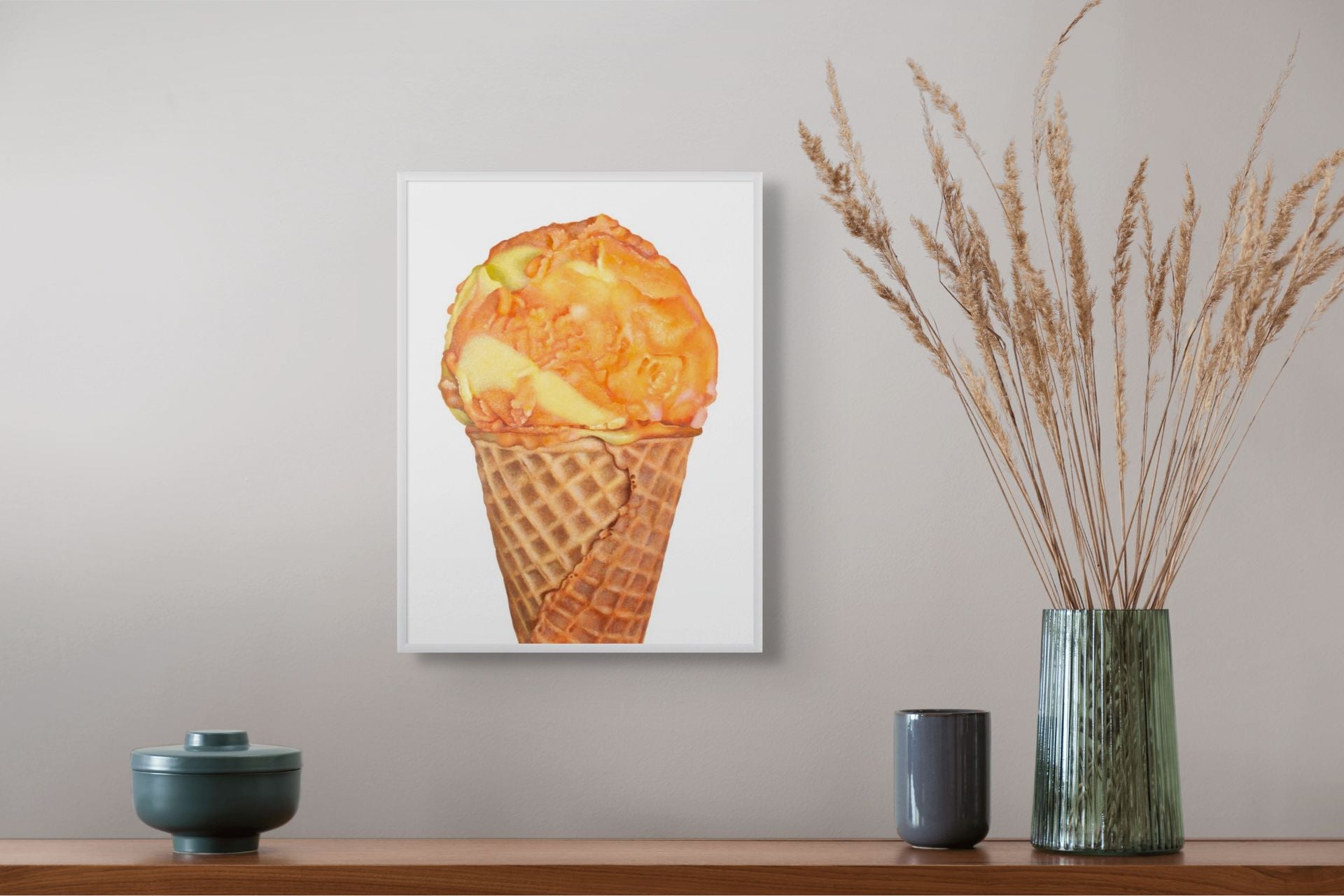 Framed 16 inch by  12 inch art print of Orange and Yelllow Sherbet by Kim Testone on a wall.