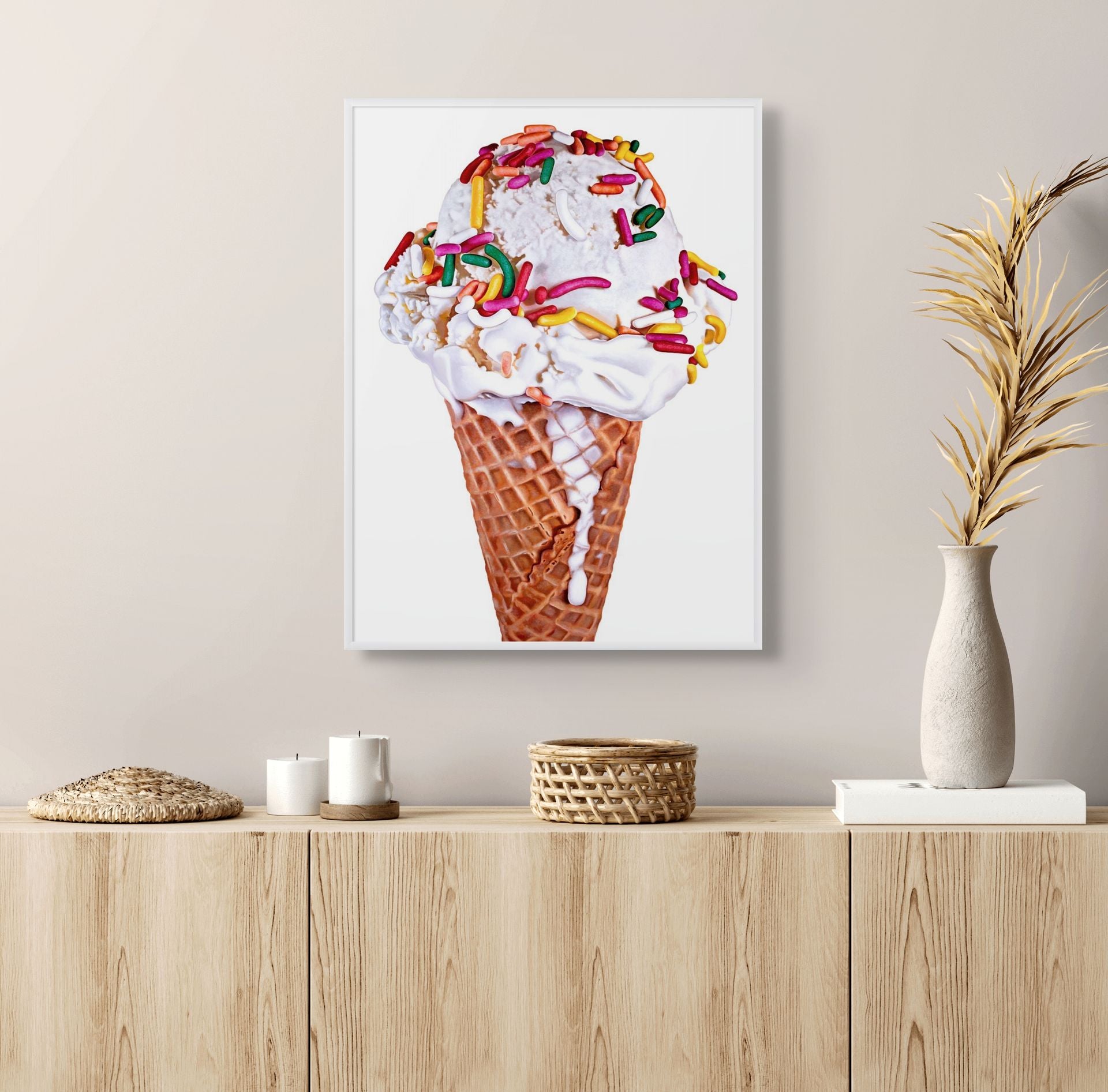 Framed version of the 20 inch by 15 inch Tall Vanilla with Rainbow Sprinkles ice cream cone print by Kim Testone on a wall.