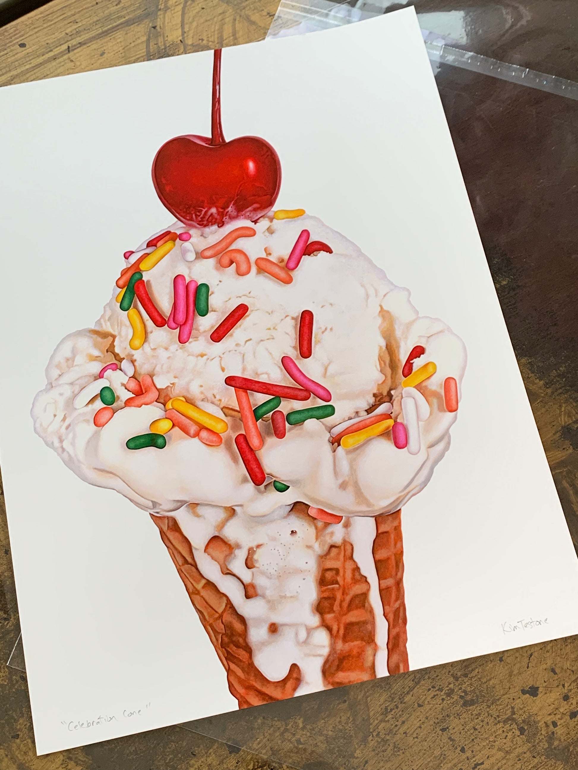 Celebration Cone art print by Kim Testone, featuring a melting vanilla ice cream cone with rainbow sprinkles and a cherry on top.
