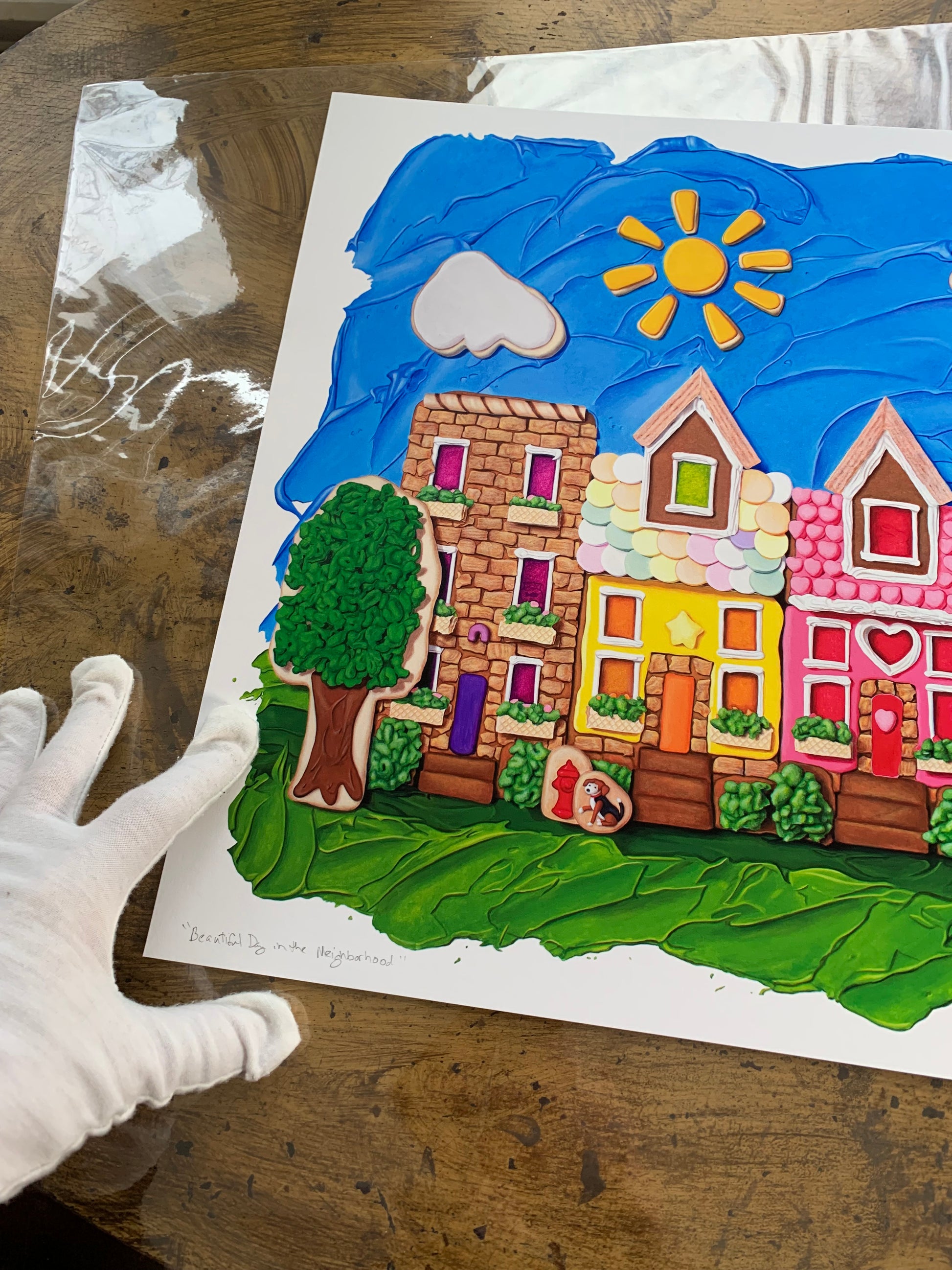 Beautiful Day in the Neighborhood art print by Kim Testone, featuring a colorful neighborhood of gingerbread row houses. Based on an original trompe l'oeil foodscape painting, which used a real-life cookie model for reference.