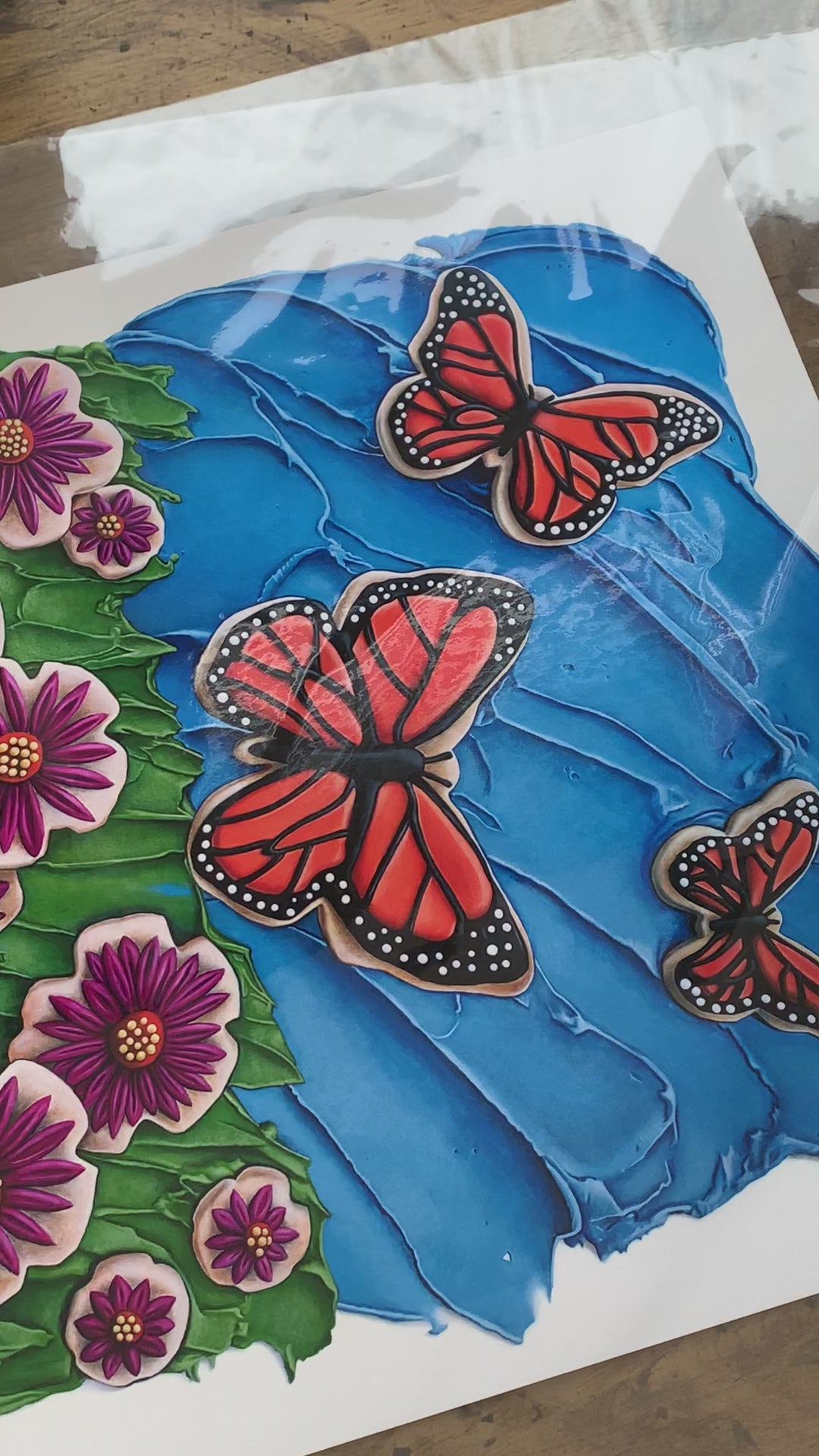 Video of a print of the Butterflies in the Sky trompe l'oeil foodscape painting by Kim Testone.